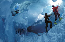 The crew of Skip Novak's yacht "Pelagic" explore an ice cavern in Antarctica.