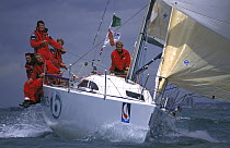 British team aboard the "Barlo Plastics" Mumm 36 race in the Admiral's Cup, Adrian Stead trims the spinnaker, 2000.