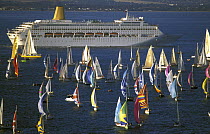 Passengers aboard the cruise liner "Oriana" watch the Fastnet fleet start their race for the 608 miles ahead, 1999.