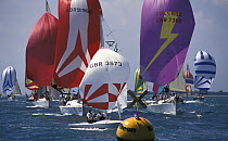 Flying Fifteen class meet the IRC yachts at the leeward mark during Cowes Week, 2001.