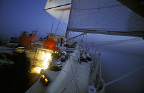 Cabin and instrument lights glow in the dark on Simon le Bon's yacht "Drum" during the Whitbread Round the World Race, 1985.