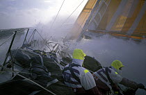 Crew get a wet ride on "The Card" in the Southern Ocean during the Whitbread Round the World Race, 1989-90.