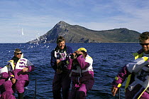 Crew aboard "The Card" celebrate rounding Cape Horn at the end of their Southern Ocean run, Whitbread Round the World Race, 1989-90.