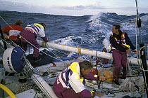Crew aboard "The Card" prepare the jury mizzen for the second time in the Southern Ocean. Whitbread Round the World Race, 1989-90.