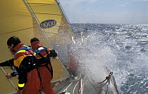 Crew aboard "Courtaulds" take a soaking on the foredeck, BT Global Challenge, 1995.
