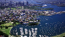 Aerial view over Sydney harbours, the Opera House and Harbour Bridge can be seen towards the top right, Australia.