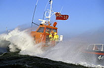 Crew of the Blythe, Scotland lifeboat try to hold on and stay dry as she crashes into heavy seas.