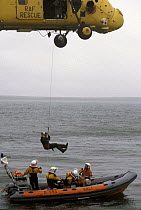 RAF rescue helicopter trains with the RNLI inshore lifeboat.