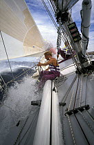 Crew on the bow of "The Card" during the Whitbread Round the World Race, 1989-90.