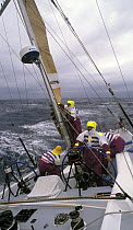 Reefing the mizzen on "The Card" during the Whitbread Round the World Race, 1989.