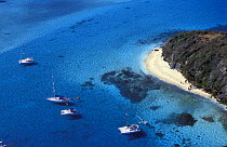 Yachts anchored off the beach at Tobago Cays, Grenadines, Caribbean.