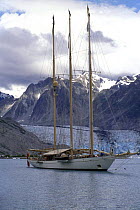 65 metre schooner "Adix" anchored off a glacier in Tracy Arm Fjord, Alaska.