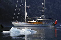 118ft S&S designed superyacht, ^Timoneer^ passes by a lazing seal on an iceberg in Fords Terror, Tongass National Forest, south-east Alaska.