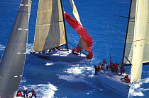 Spinnakers are dropped as the fleet arrive at the leeward mark, Key West Race Week, 2000.