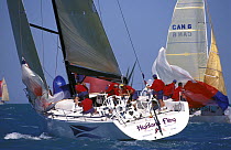 Farr 60 "Highland Fling" drops the spinnaker and rounds the leeward mark, Key West Race Week, 2000.