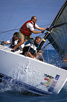 Crew of an ID35 prepare for a spinnaker hoist during Key West Race Week, 2000.