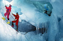 Crew of Skip Novak's yacht ^Pelagic^ explore an ice cavern in Antarctica.