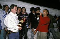 Côte d'Or skipper Eric Tabarly celebrates the finish of leg 3 in Punta del Este during the Whitbread Round the World Race, 1985.