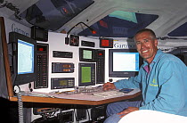 Josh Hall in the navigation station of his Open 60 "Gartmore".