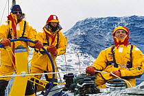 Crew on ^Intrum Justicia^ trimming the spinnaker in heavy Southern Ocean seas in the Whitbread Round the World Race, 1993.