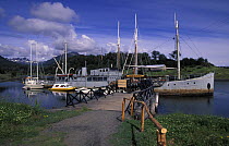 Boats moored at Puerto Williams harbour, the departure point for many yachts sailing to the Antarctic Peninsula or Cape Horn, Chile.
