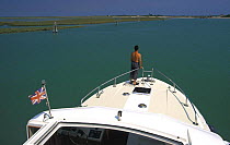 Houseboat crusing in the Venetian lagoon, Italy.
