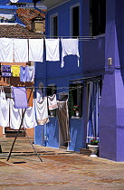 Laundry drying in the wind in Burano, Venice, Italy.
