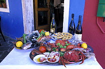Display of delicious food in Trattoria Gatto Nero, Burano, Italy.