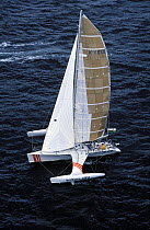 Formula 40 trimaran "Triton Sifo" skippered by Adrian Thomson during the Europe 1 Star, 1988. ^^^ Skipper Alan Thomas was towed to Nantucket by US coast-guards with the starboard float taking water.