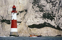 Eastbourne Lifeboat passes the Beachy Head Lighthouse. Beachy Head rises 162 metres (530 feet) above the sea below and is the highest chalk sea cliff in Britain, this is the most famous part of the Ea...