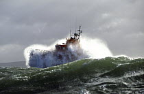 RNLI Lifeboat powering through heavy seas.