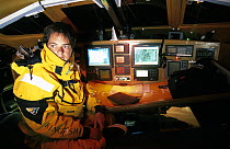 Ellen MacArthur at the nav station aboard her Open 60 "Kingfisher", in which she came 2nd in the Vendee Globe singlehanded round the world race, 2000-01.