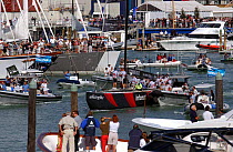 Crowds watch "Alinghi" leaving the harbour during the Millennium Cup Superyacht Regatta, Auckland, New Zealand, February 2003.