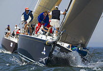 Foredeck crew preparing the bowsprit and spinnaker as they approach the weather mark at Block Island Race Week, Rhode Island, USA, 2003.
