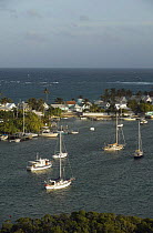 Boats moored in Hope Town harbour as seen from the Elbow Cay lighthouse, Abacos, Bahamas.