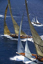 J-Class "Velsheda" and the new replica of "Ranger" (top) racing beside a smaller yacht at Antigua Classic Yacht Regatta, Caribbean, 2004.