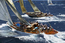 J-Class "Velsheda" and the new replica of "Ranger" (top) racing beside a smaller yacht at Antigua Classic Yacht Regatta, Caribbean, 2004.