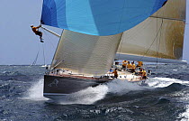 "All Smoke" the Reichel/Pugh 78 at Antigua Race Week. A crewman is at the end of the spinnaker pole having popped the kite. 2004.^^^Jochen Schuemann skippers the boat.