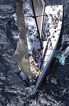 Crew memebers lowering the jib aboard the MaxZ86, "Morning Glory", at Antigua Race Week, 2004.