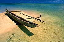 A traditional canoe, pirogue, on the beach, small island between New Hannover and New Ireland, Papua New Guinea