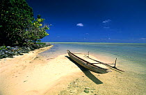 A traditional canoe, pirogue, on the beach, small island between New Hannover and New Ireland, Papua New Guinea