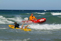 Surf rescue boat and board and lifeguards, Manly Beach, Sydney, Australia.