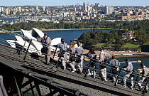 Climbing Sydney Harbour Bridge with the opera house below, Sydney, Australia.