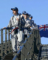 Climbing Sydney Harbour Bridge with tour guide, Sydney, Australia.