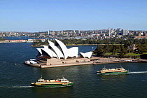Sydney Opera House with ferry boats, Sydney Harbour, Australia.