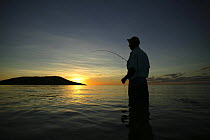 Salt water fly fishing at sunset, on the sand banks of Tevawa, Fiji.