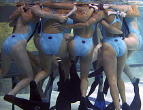 British women's underwater hockey team huddle, World Underwater Hockey Championships, Christchurch, New Zealand.