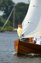 Sailing a classic wooden gaffer, Wroxham Open Regatta Week, Wroxham Broads, Norfolk, England, UK.