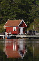 Waterfront home on the island of Lyr on the west coast of Sweden. The house is complete with jetty and boat moorings.