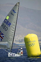 Ben Ainslie passing a marker bouy during the 10th round of the Single Handed Finn at the Olympic Games, Athens, Greece, 2004.  Editorial Use Only.